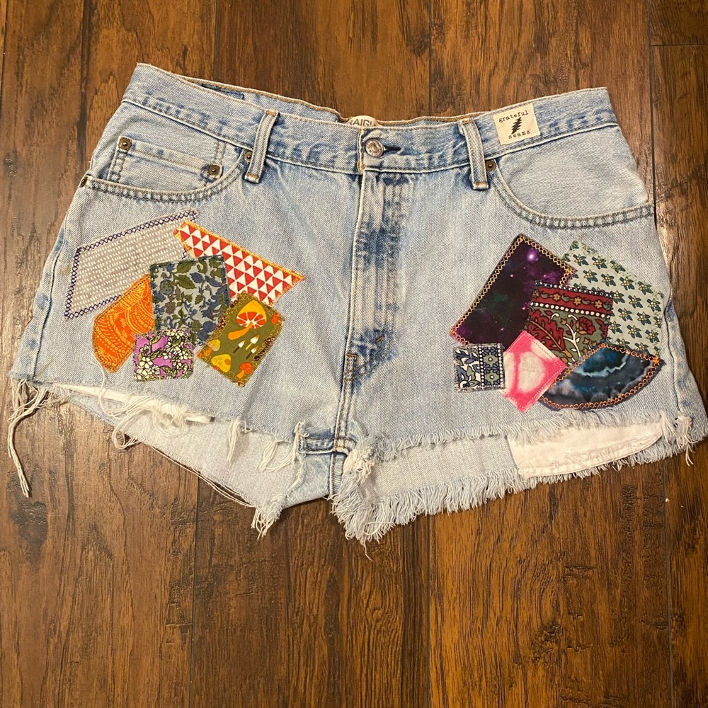 Upcycled Levi’s cutoff jean shorts with added patchwork design.